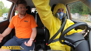 A virgin in a hazmat suit gets in the car at a fake driving school
